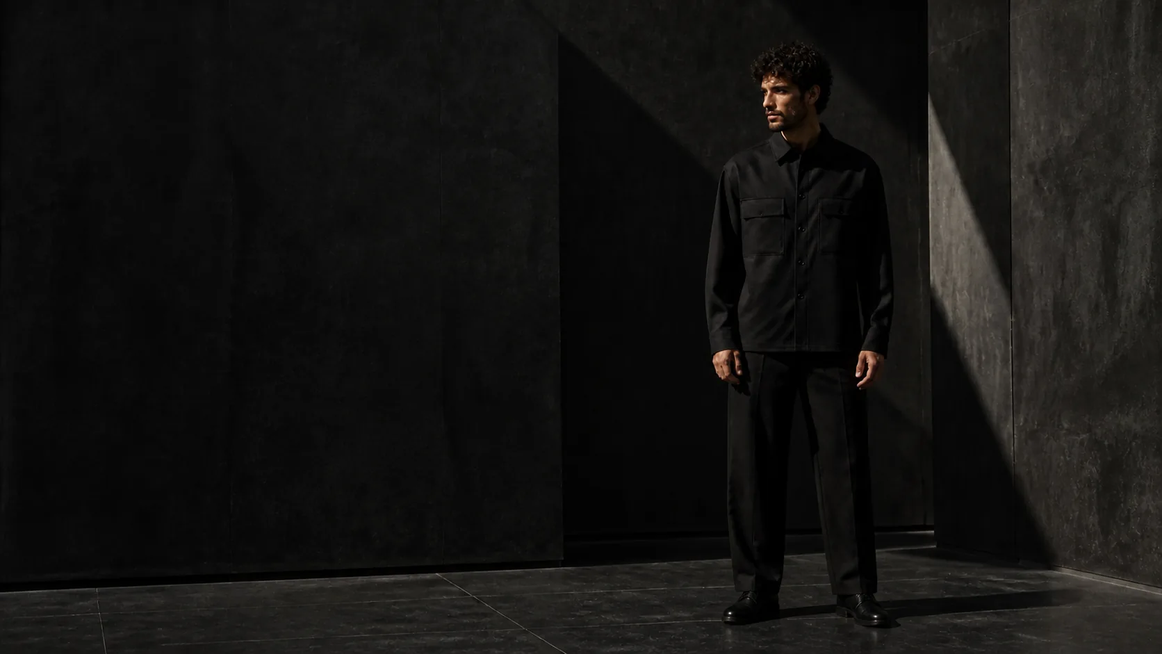 Model wearing a black heavyweight button-up overshirt